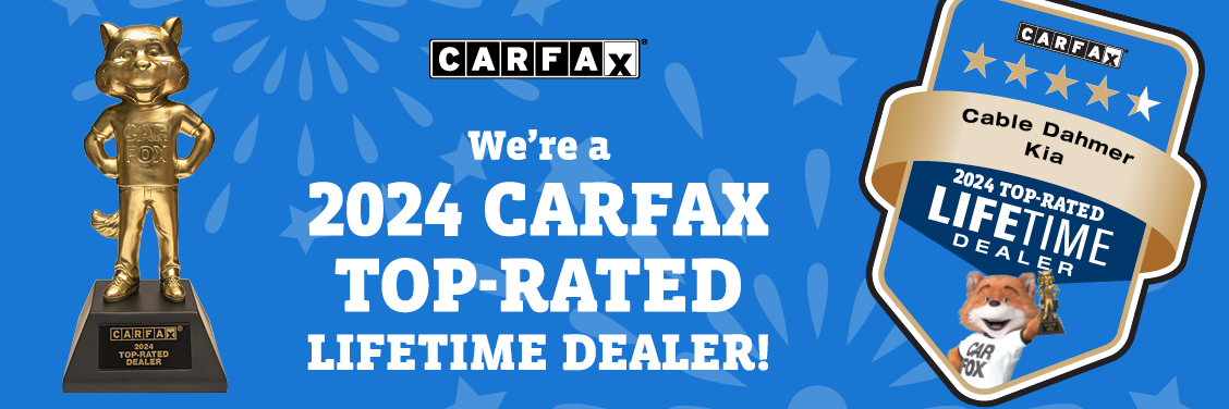 2024 Carfax Top-Rated Lifetime Dealer award trophy and badge for Cable Dahmer Kia