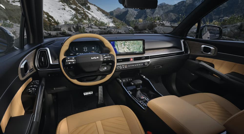 Brown and black front seats and dashboard in a 2026 Kia Sorento