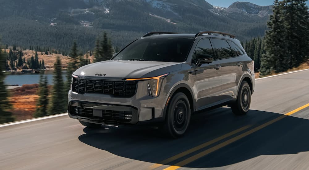 Grey 2026 Kia Sorento driving on a highway