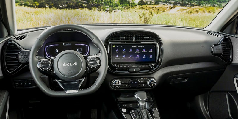 Kia Sportage 2024 interior featuring touchscreen infotainment and premium cabin materials
