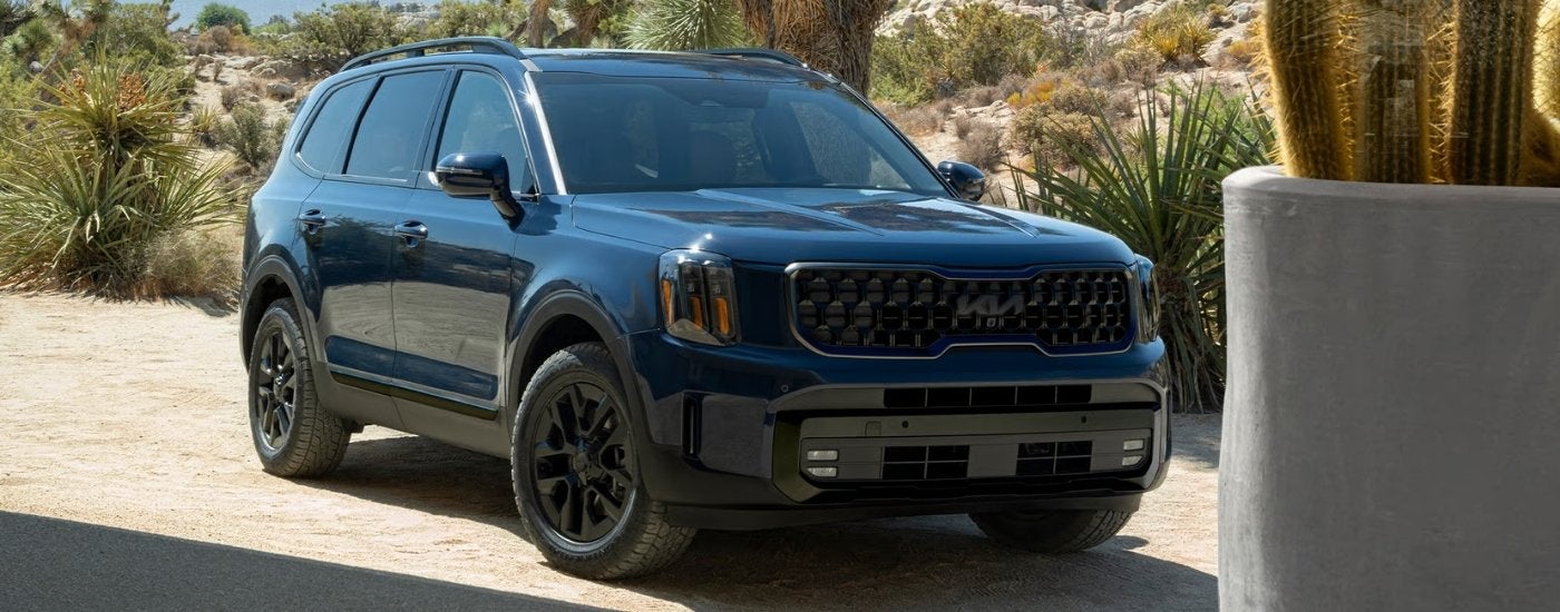 A blue 2025 Kia Telluride for sale near Blue Spring from the front.