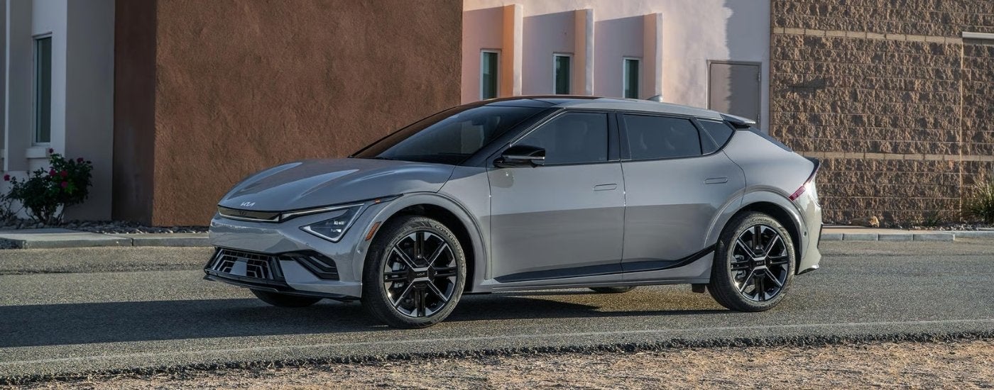 Grey 2025 Kia EV6 parked in front of a building