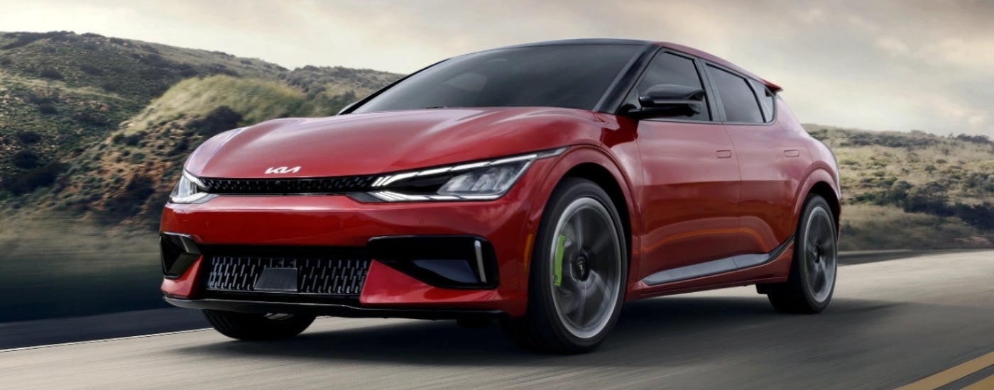 Red 2024 Kia EV6 GT driving on a highway