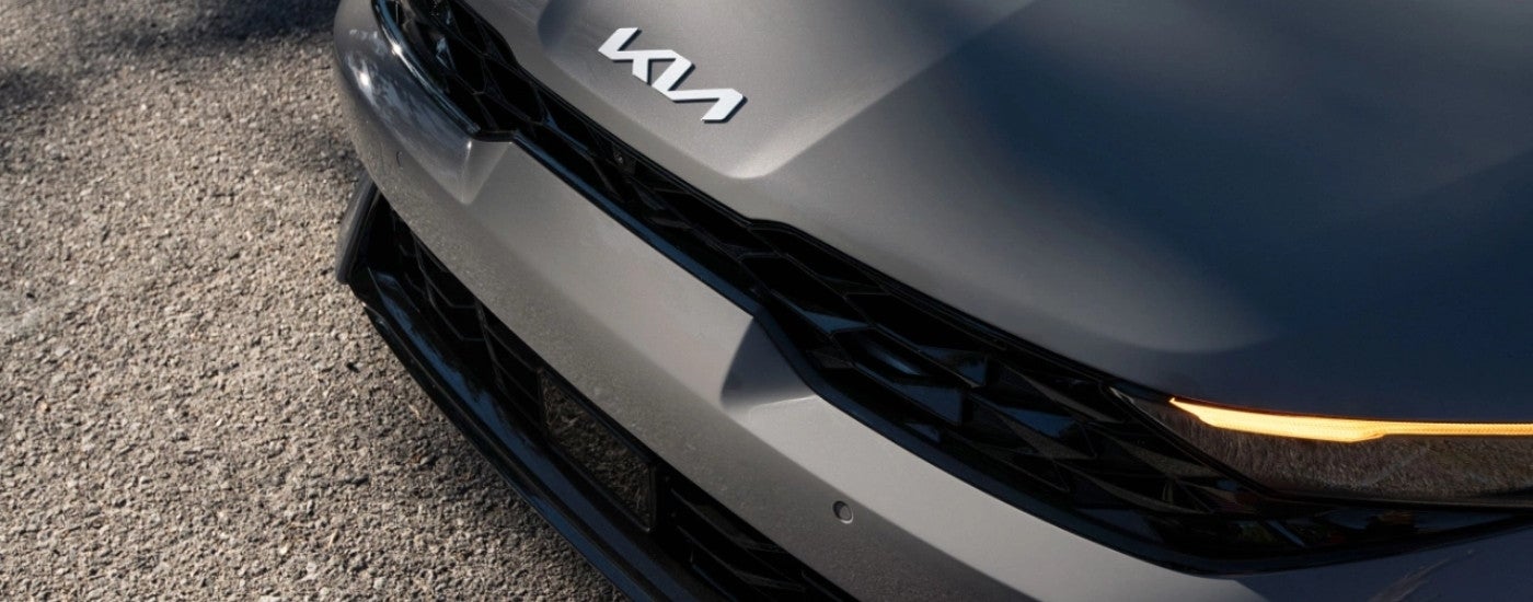Hood and headlights on a grey 2025 Kia K5
