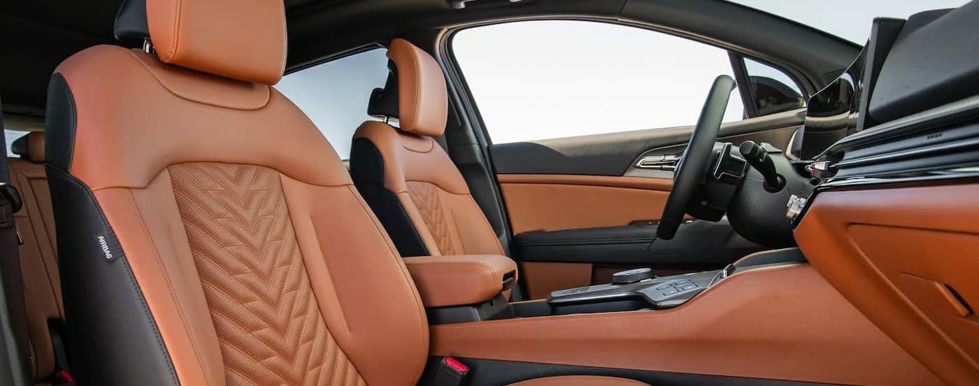 Black and tan interior and dash in a 2026 Kia Sportage.